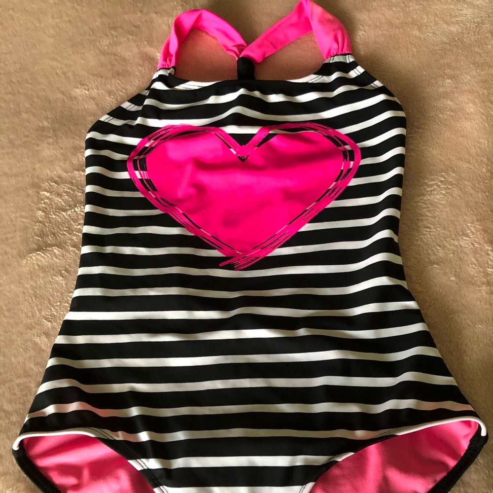 Black and white striped one-piece w/ pink accents.